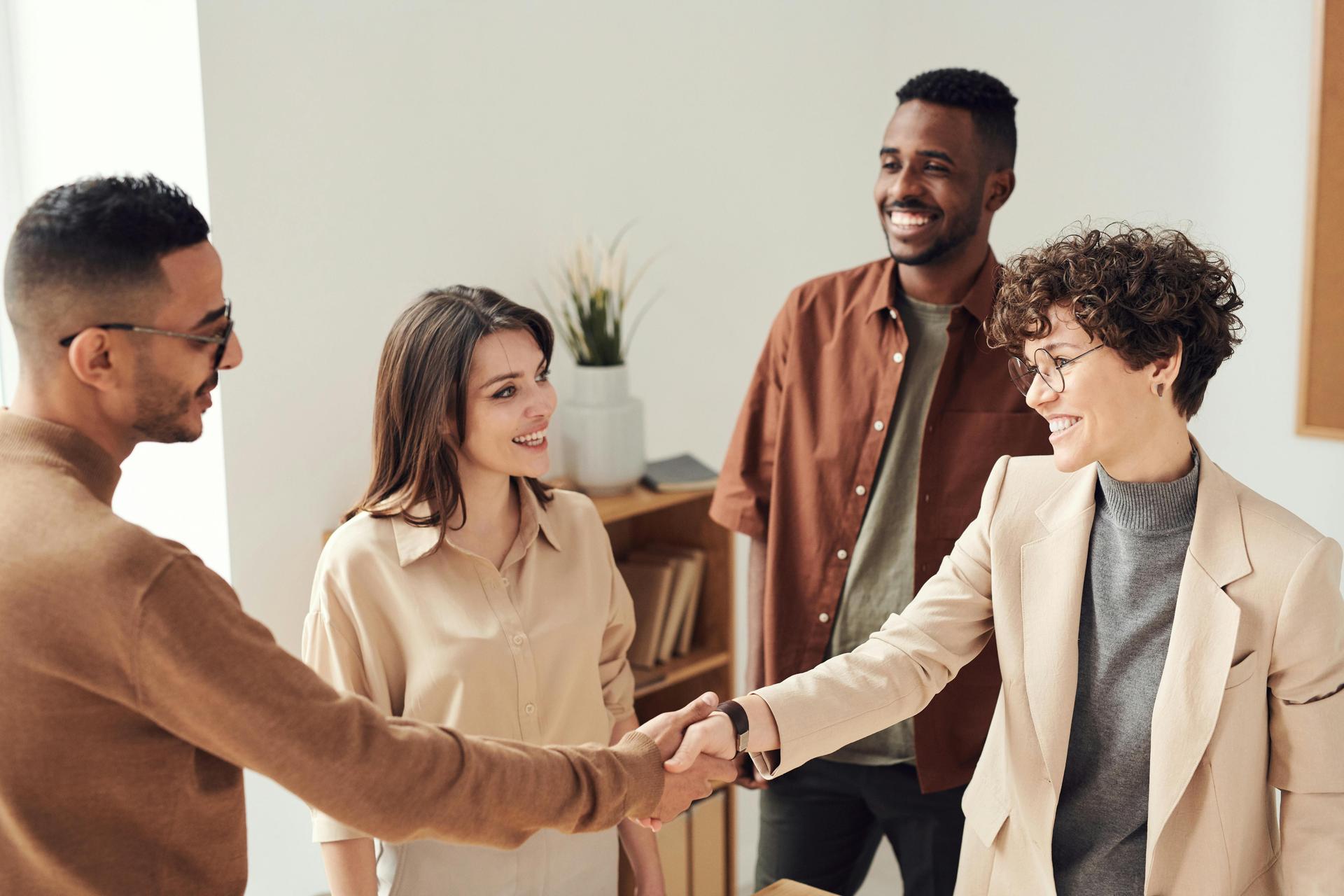 A group of people collaborating around a table in a workshop.